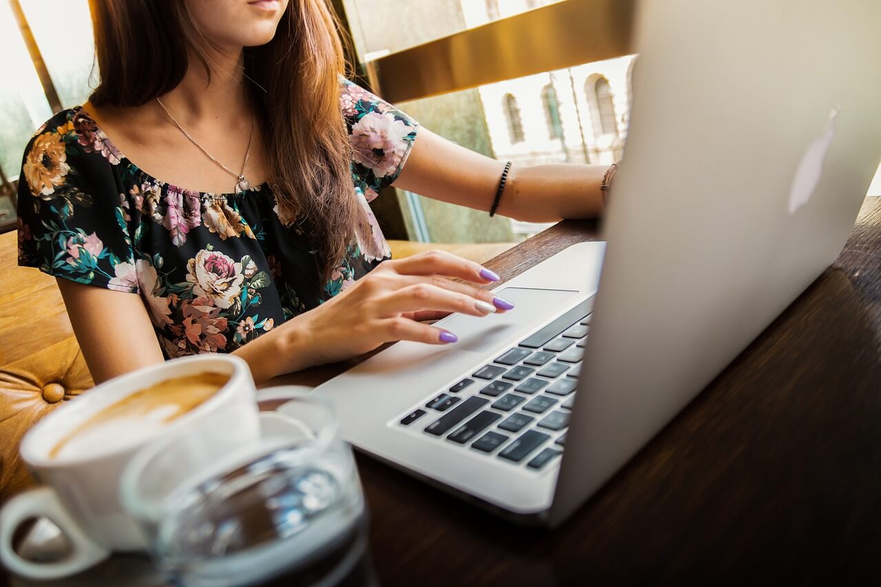 user with laptop at cafe computer on desk with user - windows 10 error response from daemon drive sharing seems blocked by a firewall