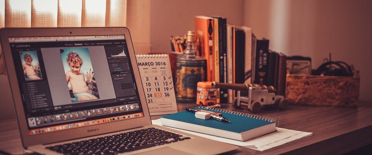 notebook on desk with pencils
